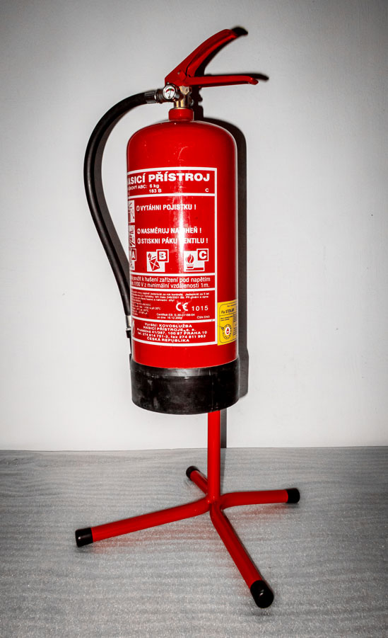 Fire extinguisher in the stand.